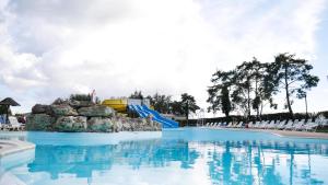 a pool at a resort with a water slide at Camping Officiel Siblu Domaine de Dugny in Onzain