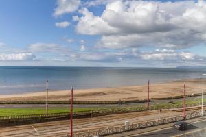 a road with a view of the beach and the ocean at HOTEL242 in Blackpool
