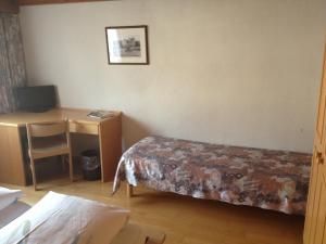 Rúm í herbergi á Café-Conditorei Hotel Huber