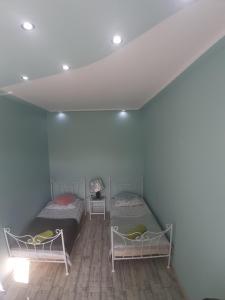 Posteľ alebo postele v izbe v ubytovaní Apartament Dworcowa