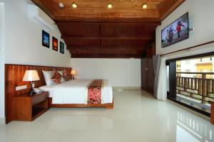 Voodi või voodid majutusasutuse Threeway Riverside Villa toas