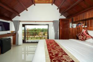 Voodi või voodid majutusasutuse Threeway Riverside Villa toas