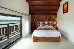 Voodi või voodid majutusasutuse Threeway Riverside Villa toas