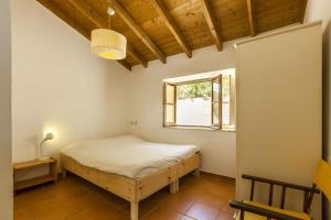 Giường trong phòng chung tại Monte Maravilhas