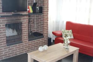 TV a/nebo společenská místnost v ubytování Park De Haeghehorst