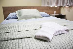 Postel nebo postele na pokoji v ubytování Blu Apart Hotel