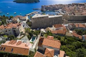 an aerial view of a town with a castle and the water at Mariposa in Dubrovnik