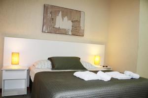 Postel nebo postele na pokoji v ubytování Blu Apart Hotel