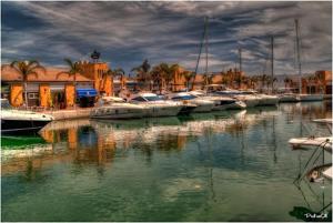 a group of boats are docked in a marina at Astonishing beach and pool house in Mazarrón +18 photos