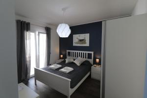 Posteľ alebo postele v izbe v ubytovaní Villa Aurora e Villa Oceano