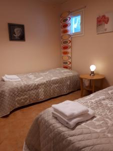Кровать или кровати в номере Apartment Varikko Kalajoki