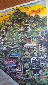 a painting of a mountain with a car on it at Tea Hills Bungalow in Hatton