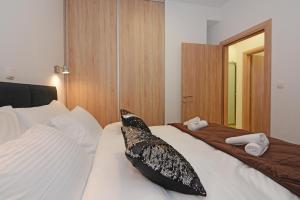 Posteľ alebo postele v izbe v ubytovaní XY Suites - Design Apartments