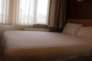 Postel nebo postele na pokoji v ubytování Cetinkaya Hotel