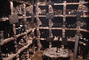 a room filled with lots of bottles of wine at Splendid Hôtel in Montreuil-Bellay