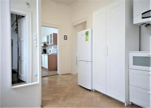 Kuchyň nebo kuchyňský kout v ubytování Angel City Aparthotel