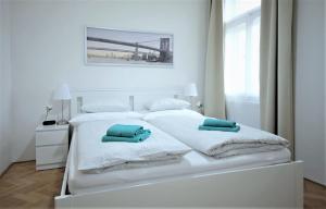Postel nebo postele na pokoji v ubytování Angel City Aparthotel