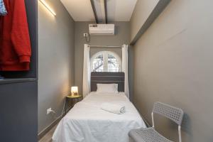 Un pat sau paturi într-o cameră la Woke Indiranagar