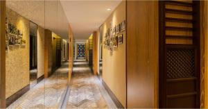 a hallway of a building with wooden floors and a staircase at LN Hotel Five in Guangzhou