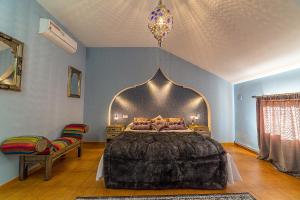 Postel nebo postele na pokoji v ubytování Hospedería Casa Martell