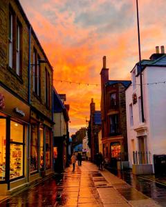 a city street with buildings and a street light at Ardconnel Bed and Breakfast in Kirkwall