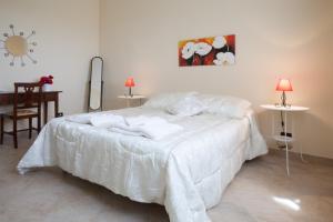 Ένα ή περισσότερα κρεβάτια σε δωμάτιο στο Villa EtnAmare