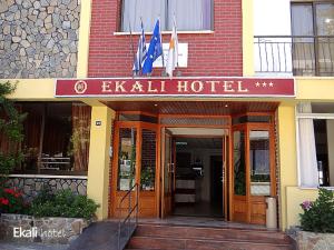 
a building with a sign on the front of it at Ekali Hotel in Kakopetria
