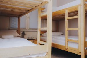 Ένα ή περισσότερα κρεβάτια σε δωμάτιο στο Bloom Inn