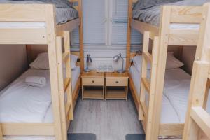 Ένα ή περισσότερα κρεβάτια σε δωμάτιο στο Bloom Inn