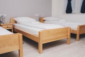 Ένα ή περισσότερα κρεβάτια σε δωμάτιο στο Bloom Inn