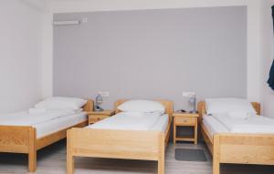 Ένα ή περισσότερα κρεβάτια σε δωμάτιο στο Bloom Inn