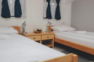 Ένα ή περισσότερα κρεβάτια σε δωμάτιο στο Bloom Inn