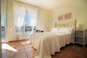 Ένα ή περισσότερα κρεβάτια σε δωμάτιο στο Apartamento El Cabo l