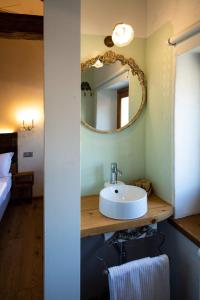 a bathroom with a sink and a mirror at Torrione Trento in Trento