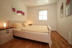 Posteľ alebo postele v izbe v ubytovaní EXCLUSIVE APARTMENTS - inclusive Zell am See-Kaprun Sommerkarte und unbegrenztem Tauern SPA Eintritt