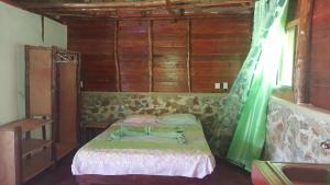 a bedroom with a bed and a dresser at Villa La Caleta in Las Galeras