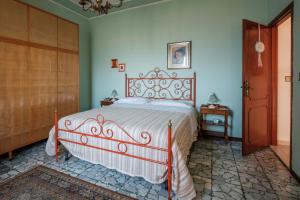 Tempat tidur dalam kamar di La terrazza del Bimbo