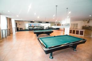 a large room with two pool tables in it at Club Morocco Beach Resort and Country Club in Subic