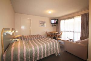 Postel nebo postele na pokoji v ubytování Beaumaris Bay Motel