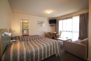 Postel nebo postele na pokoji v ubytování Beaumaris Bay Motel