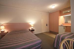 Postel nebo postele na pokoji v ubytování Beaumaris Bay Motel