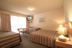 Postel nebo postele na pokoji v ubytování Beaumaris Bay Motel