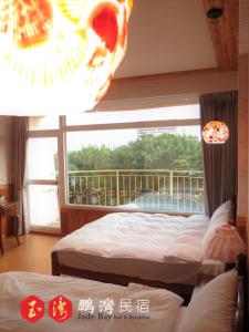 Cama o camas de una habitación en 玉灣鵬灣民宿Jade Bay B&B