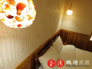 Cama o camas de una habitación en 玉灣鵬灣民宿Jade Bay B&B