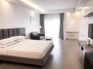 Postel nebo postele na pokoji v ubytování Winds Boutique Hotel