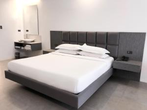 Postel nebo postele na pokoji v ubytování Winds Boutique Hotel