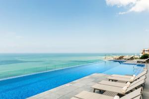 a swimming pool with a view of the ocean at Hyatt Regency Cartagena in Cartagena de Indias