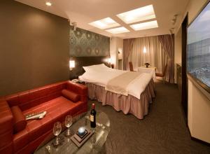 Ein Bett oder Betten in einem Zimmer der Unterkunft Carrot ISE (Adult Only)