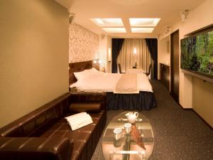Ein Bett oder Betten in einem Zimmer der Unterkunft Carrot ISE (Adult Only)