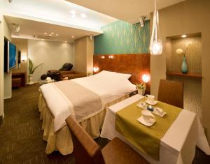 Ein Bett oder Betten in einem Zimmer der Unterkunft Carrot ISE (Adult Only)